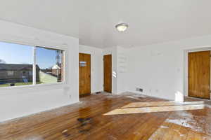 Unfurnished room with hardwood / wood-style floors