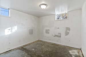 Spare room with healthy amount of natural light