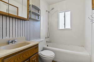 Full bathroom featuring vanity and  shower combination
