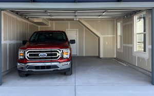 Garage featuring a garage door opener