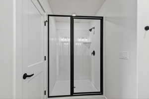 Full bathroom with a shower stall