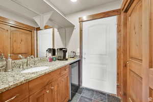 Bathroom featuring vanity and wine cooler
