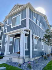 View of front facade featuring board and batten siding