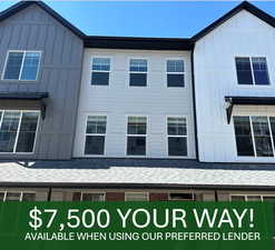 View of property exterior with board and batten siding and roof with shingles