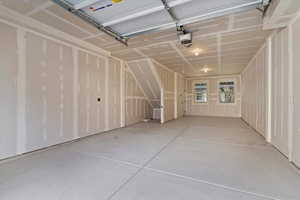 Garage featuring a garage door opener