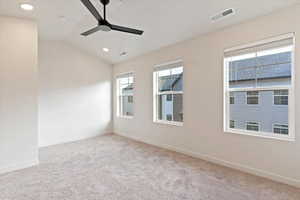 Unfurnished room with vaulted ceiling, light carpet, a ceiling fan, and recessed lighting