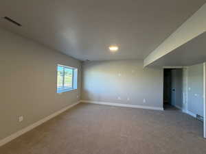Empty room with baseboards and carpet flooring