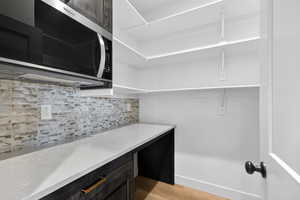 Spacious closet with light wood-type flooring