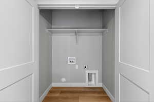 Laundry area featuring washer hookup, light wood-style flooring, and hookup for an electric dryer