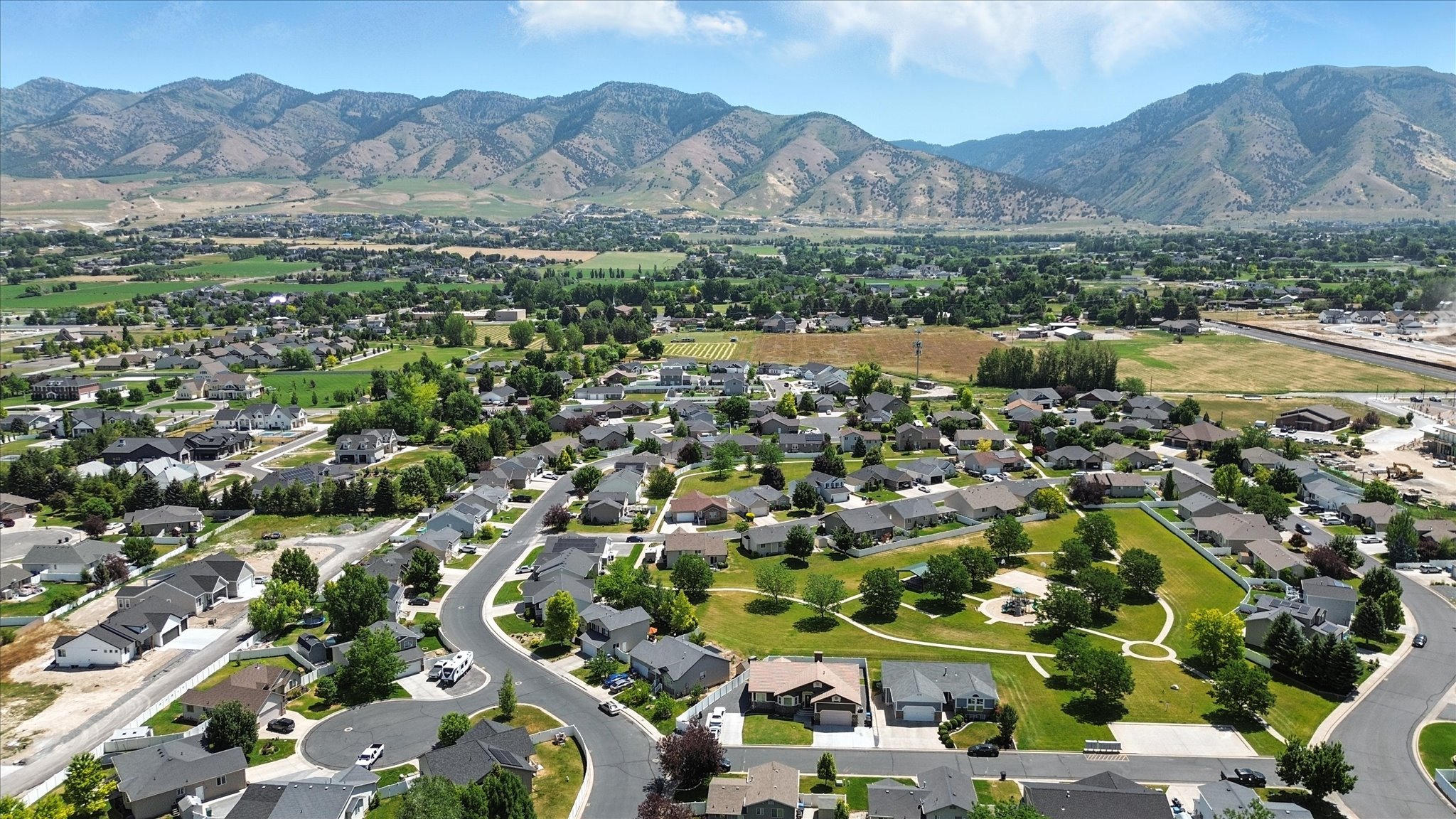 Aerial view of property's location featuring nearby suburban area