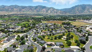 Aerial view of property's location featuring nearby suburban area