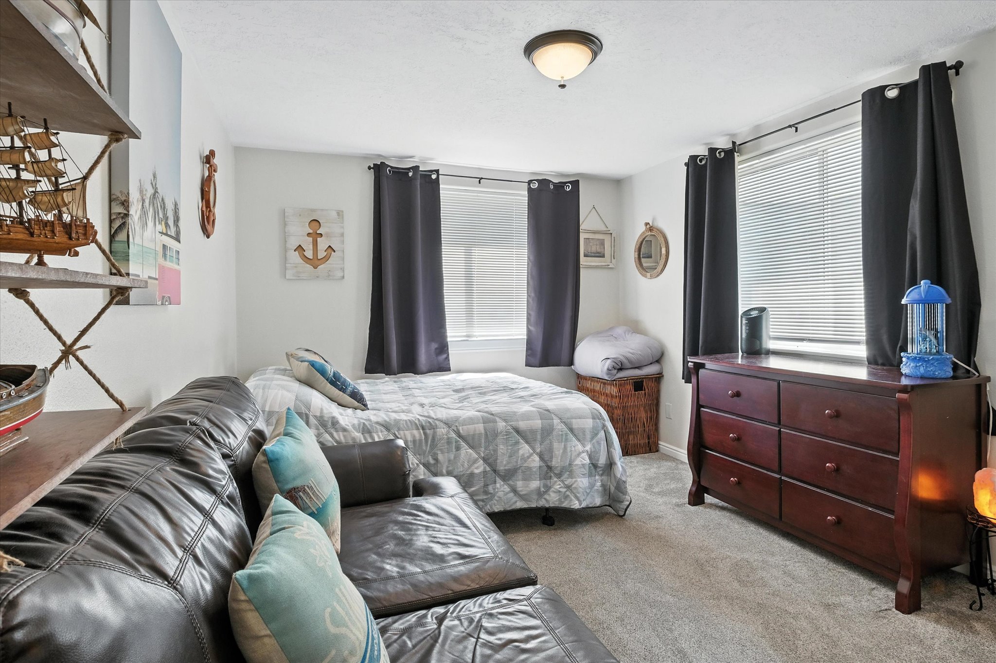 Bedroom featuring carpet flooring and multiple windows