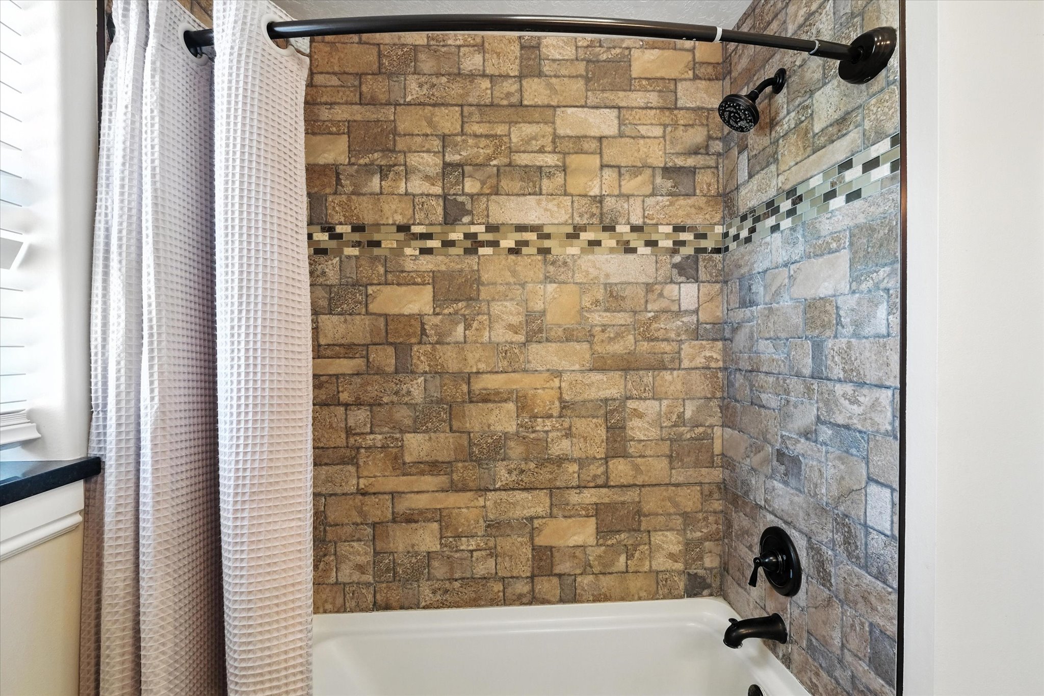 Full bath featuring shower / bathtub combination with curtain