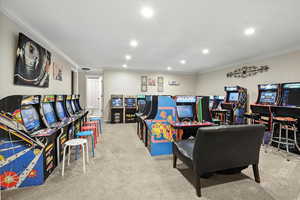 Rec room with recessed lighting, carpet flooring, and crown molding