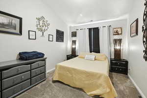 Carpeted bedroom with baseboards