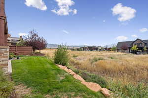 View of yard featuring a mountain view and a rural view