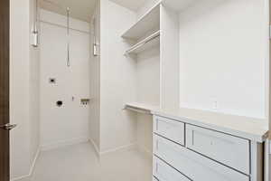 Walk in closet featuring light tile patterned flooring