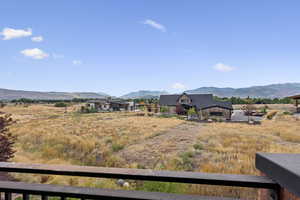 View of mountain backdrop with rural landscape