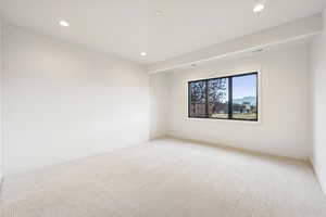 Unfurnished room with carpet and recessed lighting