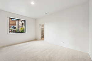 Spare room featuring carpet and recessed lighting