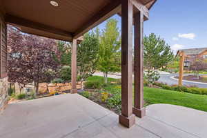 Covered porch with a yard