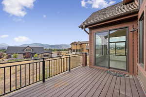 Wooden deck with a mountain view and a residential view