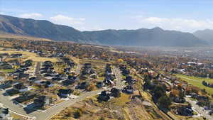 View of mountain backdrop featuring nearby suburban area