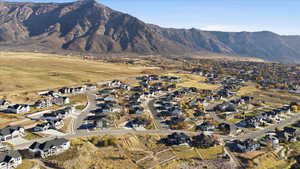 View of mountain backdrop featuring nearby suburban area