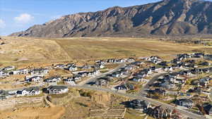 View of mountain backdrop with nearby suburban area