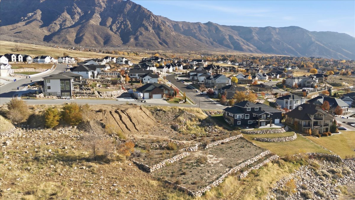 View of mountain backdrop with nearby suburban area