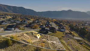 Aerial view of property's location featuring nearby suburban area and property parcel outlined