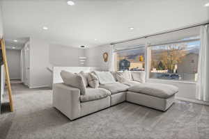 Living room featuring carpet and recessed lighting