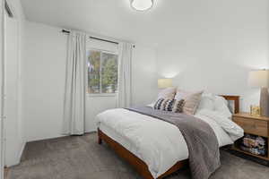 Carpeted bedroom with baseboards