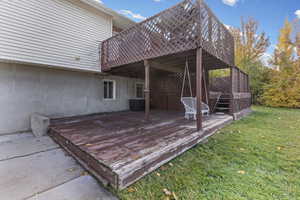 Deck featuring a lawn and stairs