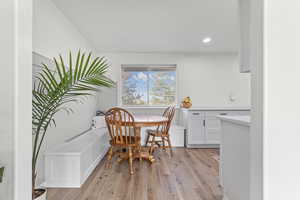 Dining room featuring light wood-style flooring, recessed lighting, and breakfast area