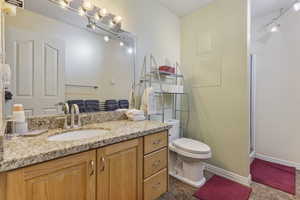 Full bath featuring vanity and a stall shower
