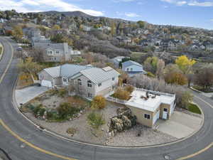 Aerial perspective of suburban area featuring a mountainous background