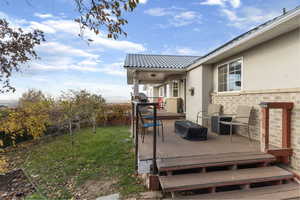 View of yard featuring a wooden deck