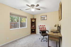 Bedroom/Office with light carpet and a ceiling fan
