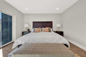 Bedroom featuring wood finished floors and recessed lighting