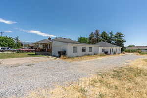 View of front facade with driveway and an attached garage