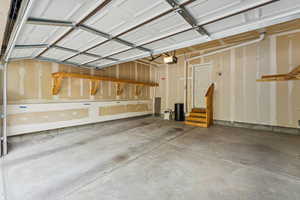 Garage featuring a garage door opener