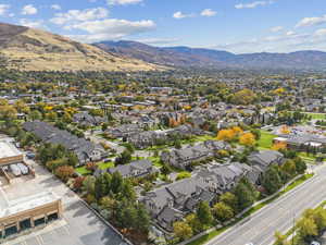 Aerial perspective of suburban area with a mountain backdrop