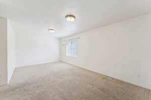 Unfurnished room featuring carpet flooring