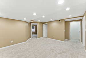 Finished basement featuring recessed lighting and light colored carpet