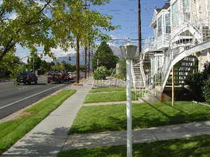 View of community featuring stairs and a yard