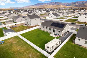Aerial view of residential area featuring a mountain backdrop