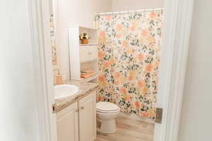 Bathroom with vanity and light wood finished floors
