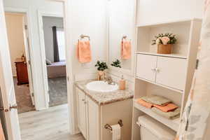 Bathroom with vanity and light wood-style flooring