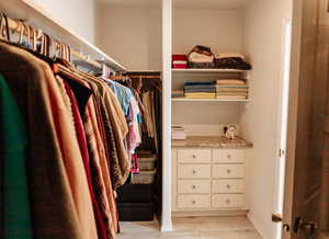Walk in closet featuring light wood finished floors